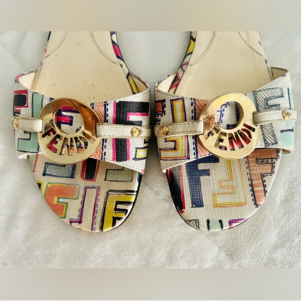 FENDI Multicolor Canvas Flat
Slide Sandals featuring a decorative logo buckle.